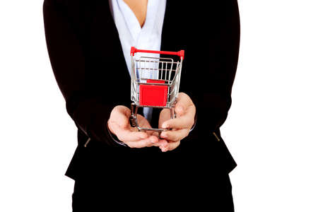 Business woman holding shopping cartの写真素材