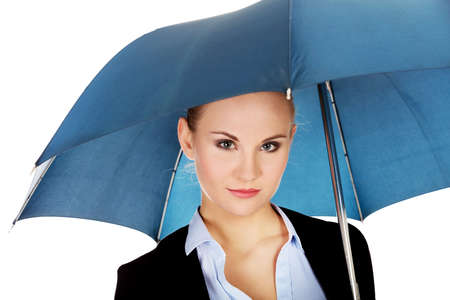 Blonde business woman holding an umbrellaの写真素材