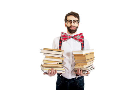 Man wearing suspenders with stack of books.の写真素材