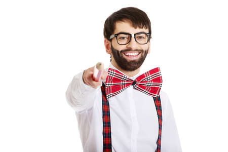 Old fashioned man pointing on you with big pencil.の写真素材