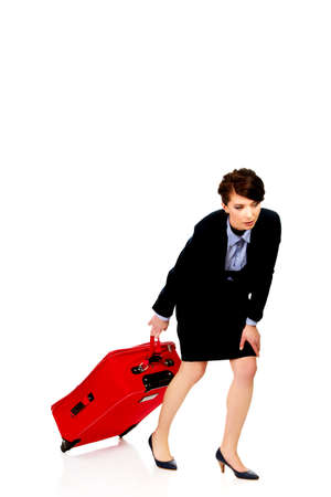 Tired businesswoman with suitcase.の写真素材