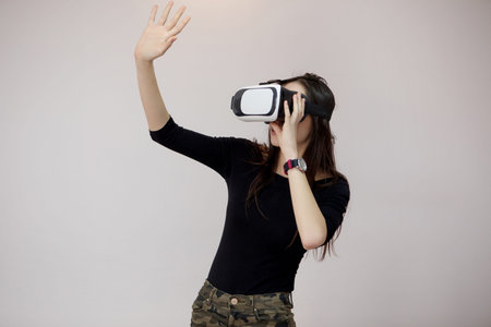 Happy woman wearing virtual reality goggles