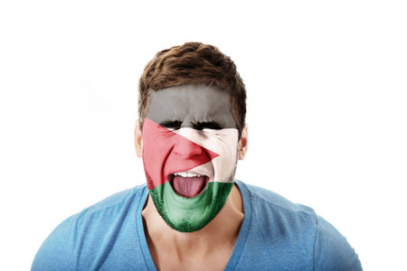 Screaming man with Palestine flag on face.の写真素材