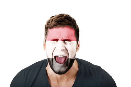 Screaming man with Egypt flag painted on face.の写真素材