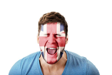 Screaming man with Great Britain flag painted on face.の写真素材