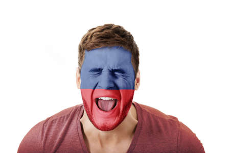 Screaming man with Lichtenstein flag on face.の写真素材