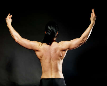 Muscular bodybuilder woman showing her muscles.の写真素材