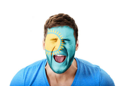 Screaming man with Kazakhstan flag on face.の写真素材