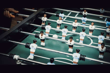 Friends playing table football.の写真素材