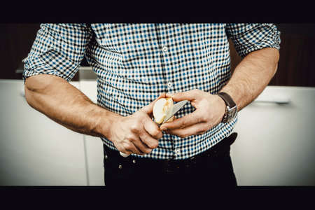 Man cooking in kitchen at home.の写真素材