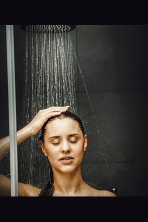 Woman standing at the shower.