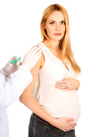 Pregnant woman getting vaccineの写真素材