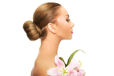Beautiful spa woman with lily.の写真素材