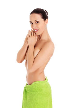 Young beautiful woman after bath full portrait isolated over white.の写真素材