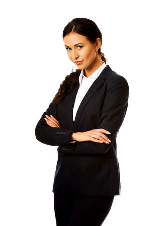 Businesswoman standing with folded armsの写真素材