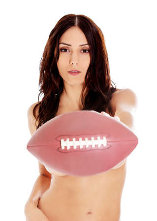 Beautiful nude woman holding american football ball.の写真素材