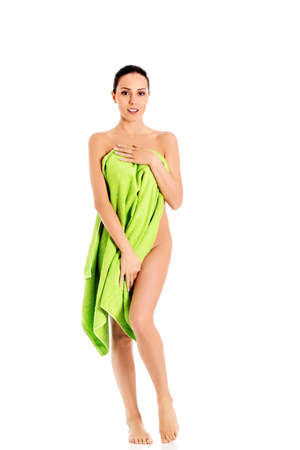 Young beautiful woman after bath full portrait isolated over white.の写真素材
