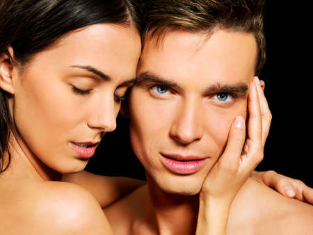Portrait of young heterosexual couple loving each other with passion.の写真素材