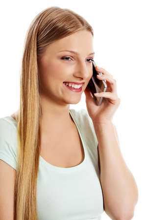 Attractive young woman making a phone call.の写真素材