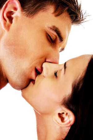 Close up of a nude couple kissingの写真素材