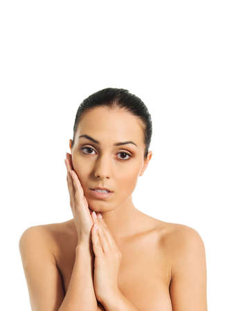 Beautiful spa woman covering her breastの写真素材