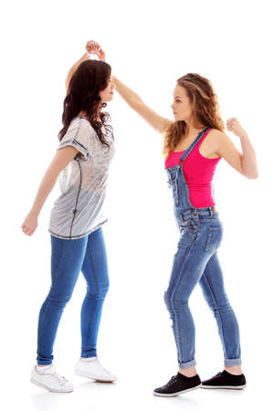 Two furious women fighting and screamingの写真素材