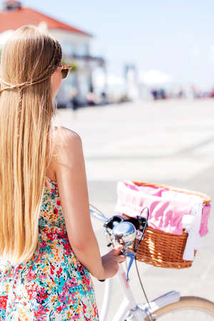 Portrait of a pretty woman on bicycleの写真素材
