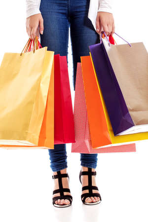 Woman with a lot of shopping bagsの写真素材
