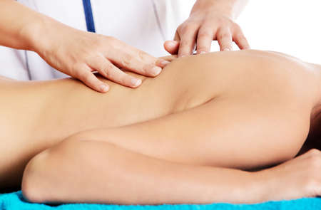 Woman having massage of body in the spa salon. Beauty treatment concept.の写真素材