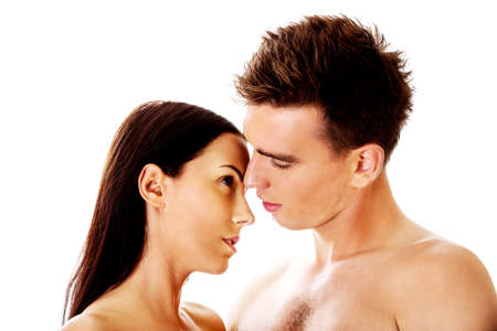 Close up of a nude couple kissingの写真素材