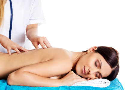 Woman having massage of body in the spa salon. Beauty treatment concept. Isolated.の写真素材