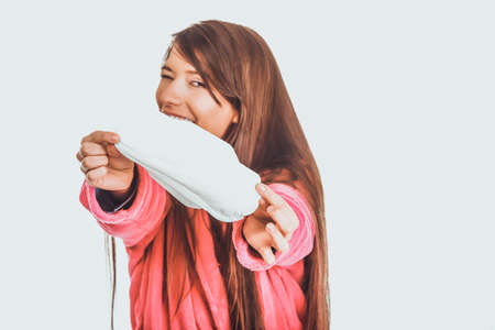 Woman in pink bathrobe with menstruation pad.の写真素材