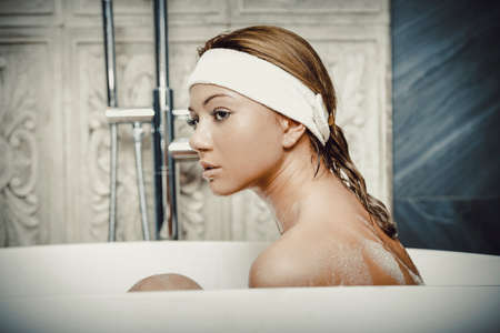Bathing woman relaxing in bath.の写真素材