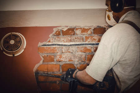 Adult worker remove demolish wall.の写真素材