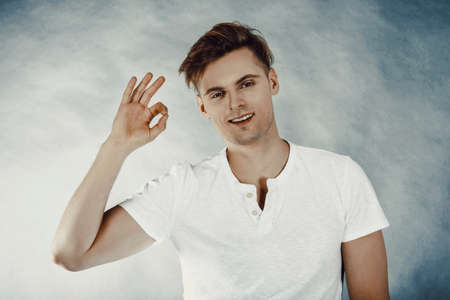 Happy man with perfect hand signの写真素材