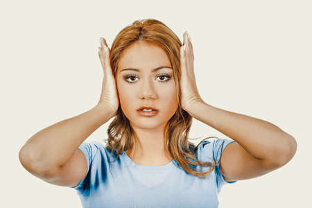 Woman covering her ears.の写真素材