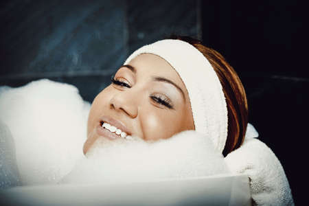 Bathing woman relaxing in bath.の写真素材