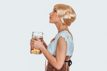 Beautiful bavarian woman with beer.の写真素材