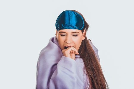 Morning woman wrapped in coverlet.の写真素材