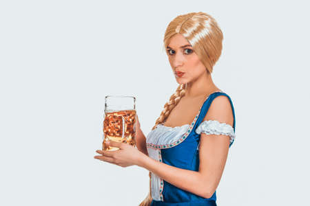 Beautiful bavarian woman with beer.の写真素材