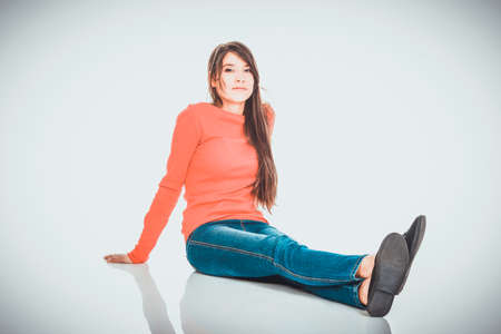 Relaxing woman sitting on the floor.の写真素材