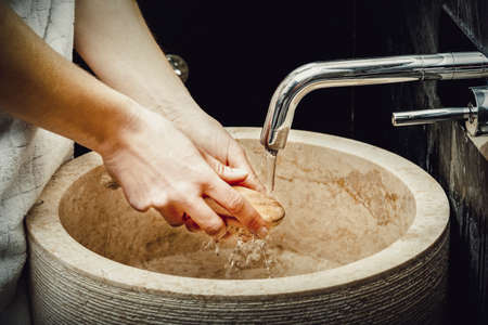 Woman cleaning her hands.の写真素材