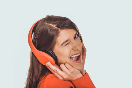 Woman with headphones listening music.の写真素材