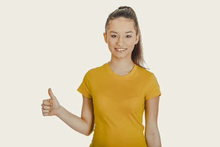 Happy woman with thumbs up.の写真素材