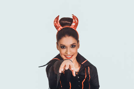 Woman in devil carnival costume.の写真素材