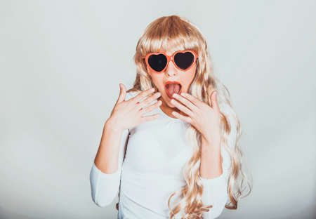 Sexy shocked blonde woman in sunglasses.の写真素材