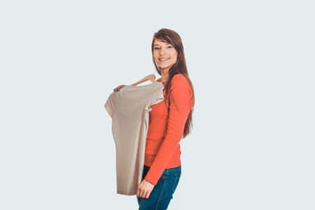 Happy woman with a new shirt.の写真素材