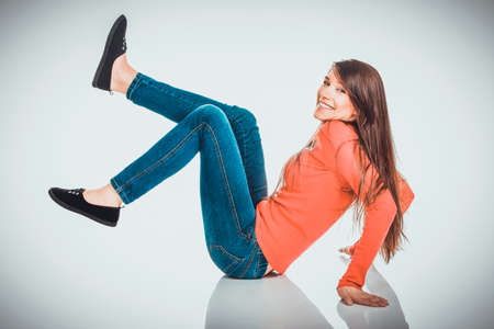 Relaxing woman sitting on the floor.の写真素材