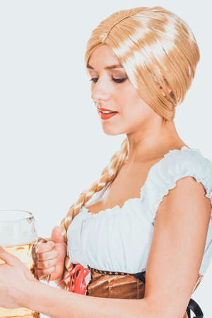 Beautiful bavarian woman with beer.の写真素材