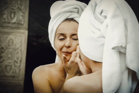 Woman squeeze her acne.の写真素材